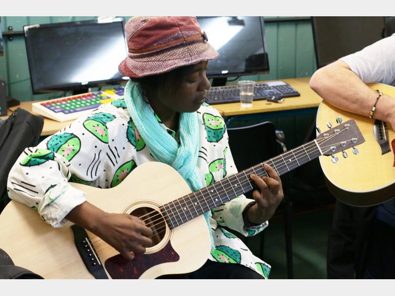 Guitar student in class